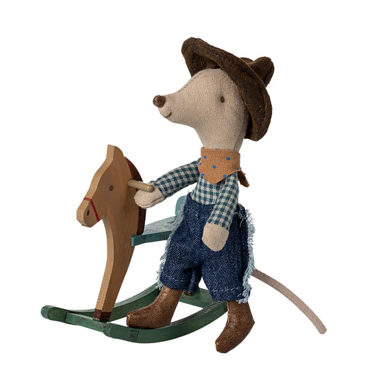 Stuffed mouse toy in cowboy outfit riding a wooden rocking horse on a white background