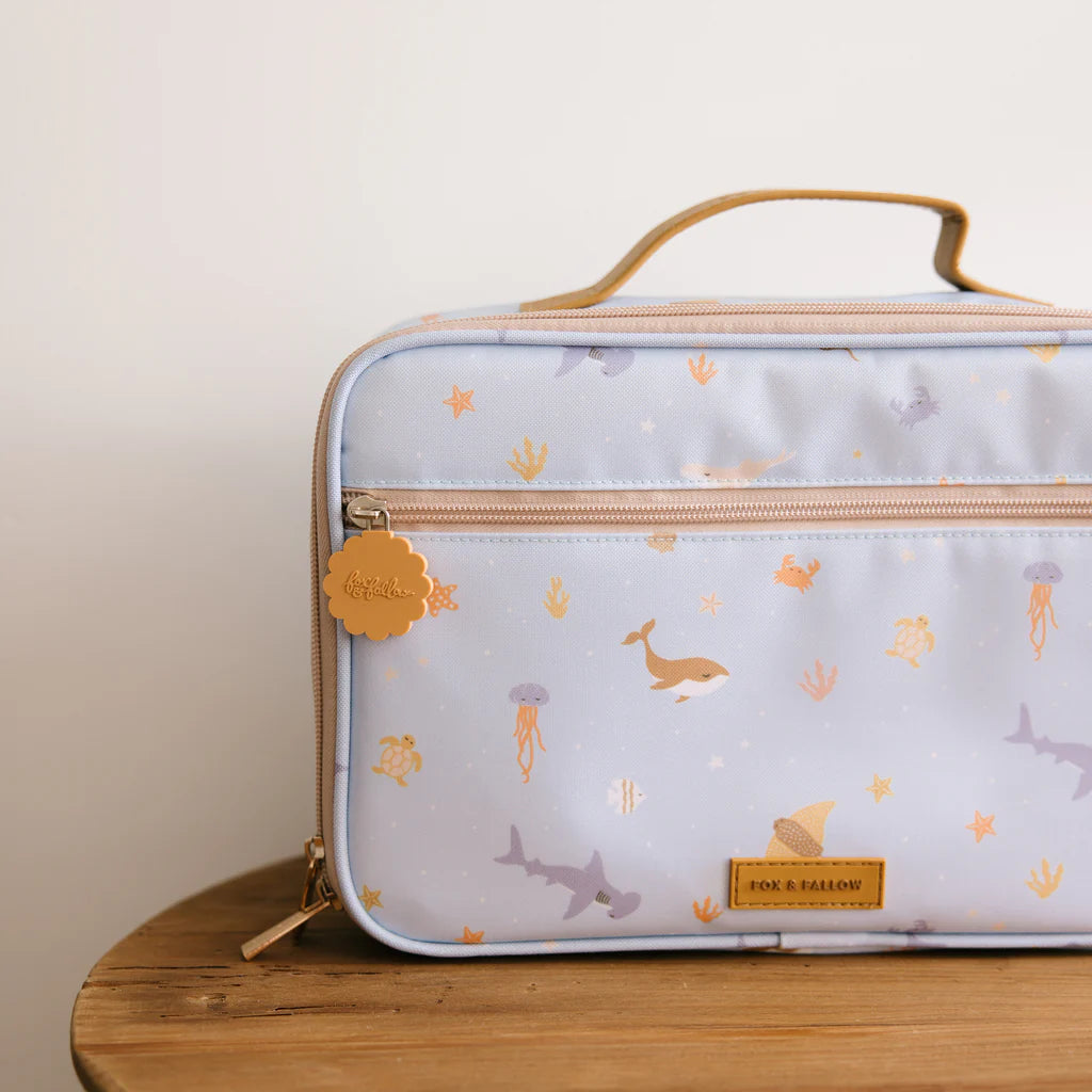 Rectangular lunch bag with animal pattern on a wooden surface
