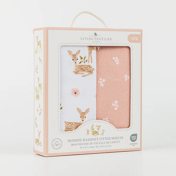 Packaging of Living Textiles bedside bassinet fitted sheets with deer illustrations on a white background