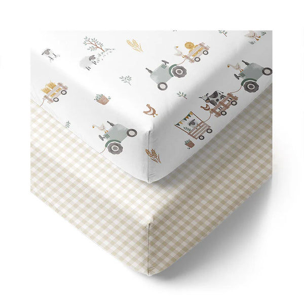 Fitted crib sheet with farm-themed design on a white background