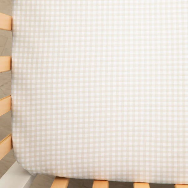 Textured fabric on a wooden chair with a white background