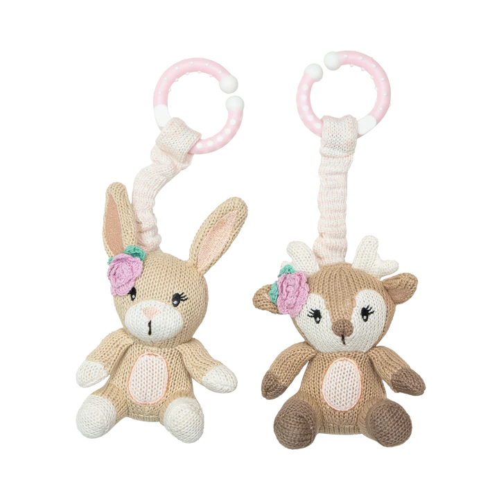 Two knitted animal toys, one resembling a rabbit and the other a deer, with pink floral accents on a white background.