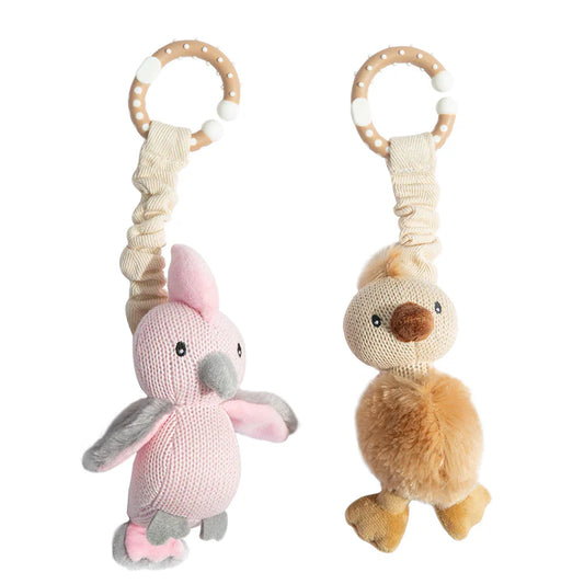 Two knitted animal toys with rattles on a white background