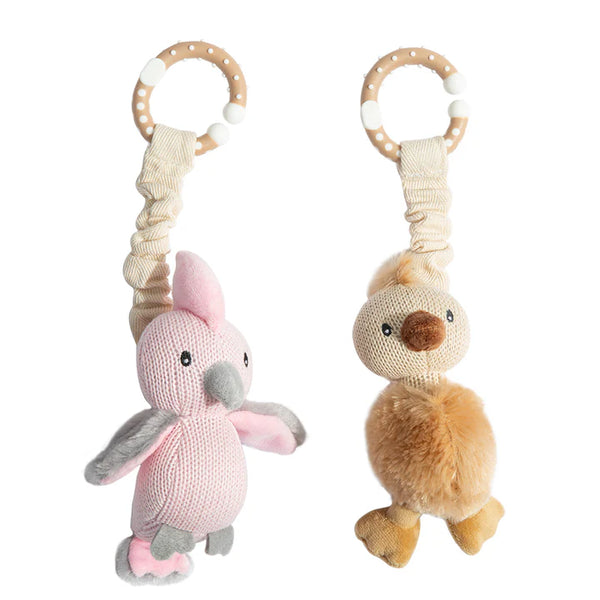 Two knitted animal toys with rattles on a white background