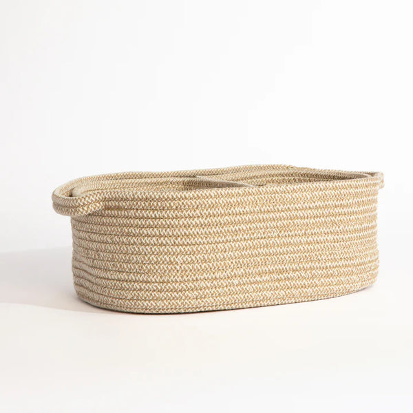 Beige woven basket on a white background