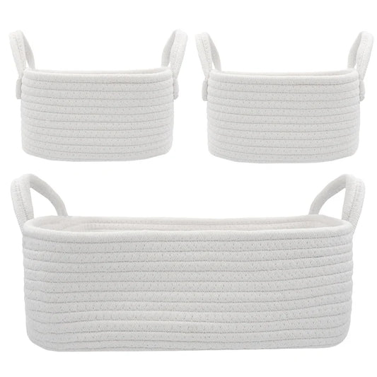 Three white woven baskets with handles on a white background