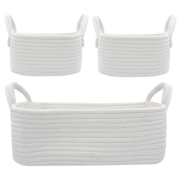 Three white woven baskets with handles on a white background