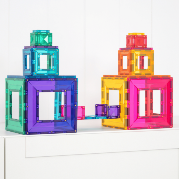 Colorful magnetic building blocks on a white surface
