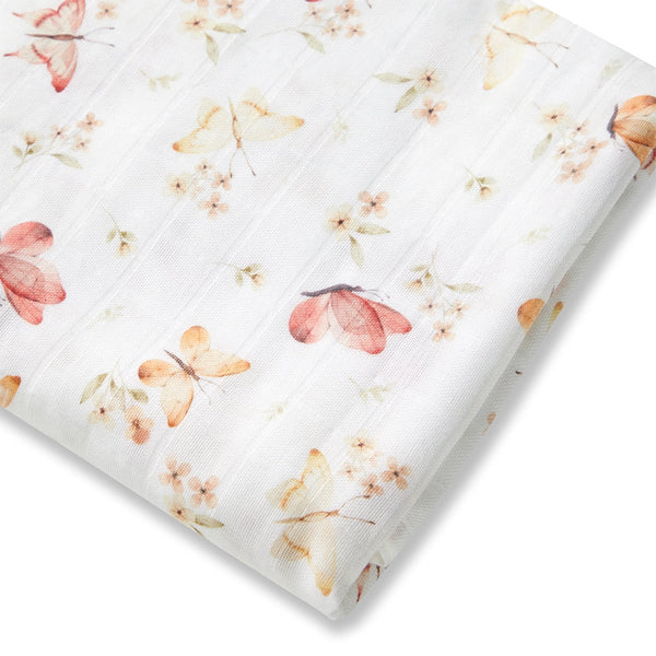 Butterfly and Floral-patterned fabric with pink and orange flowers on a white background