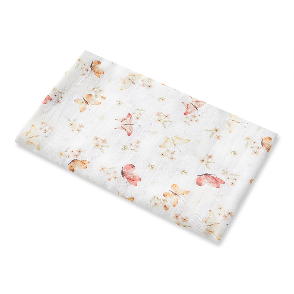 Butterfly and Floral-patterned fabric on a white background