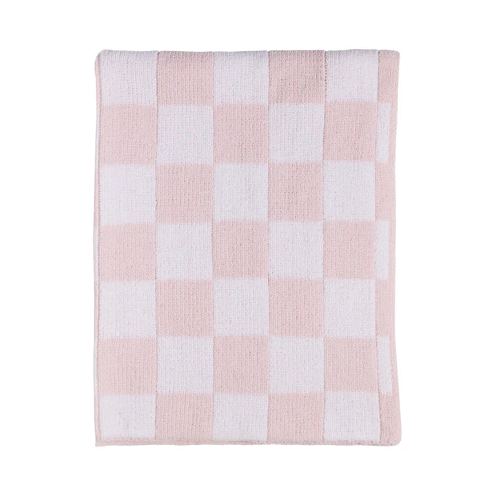 Pink and white checkered blanket on a white background