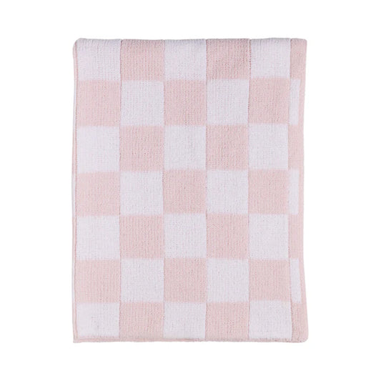 Pink and white checkered blanket on a white background