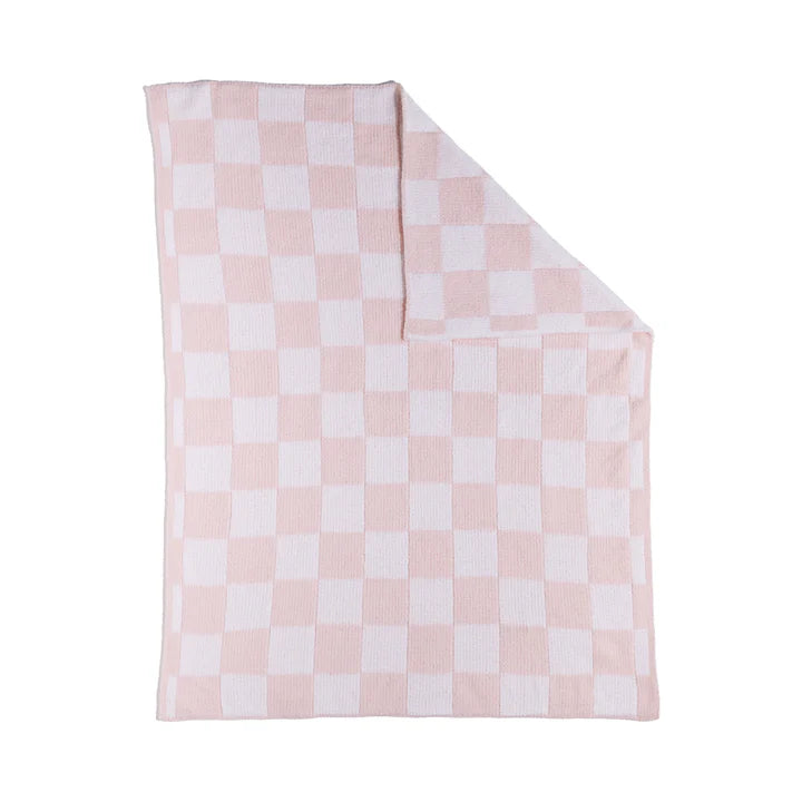 Pink and white checkered blanket on a white background