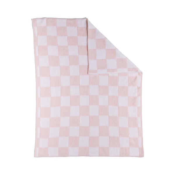 Pink and white checkered blanket on a white background