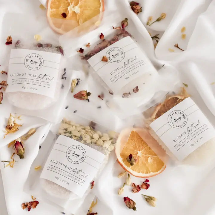 Various bath products with visible branding on a white background
