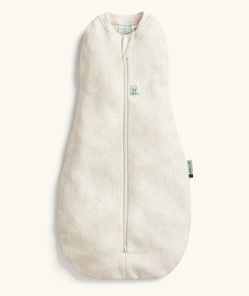 Beige baby sleeping bag with a zipper on a white background