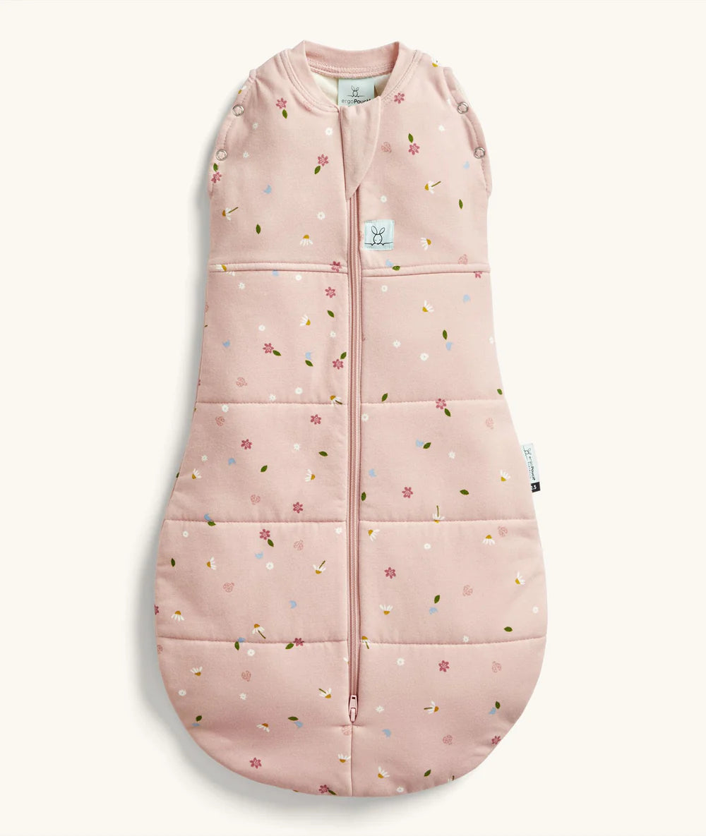 Pink baby sleeping bag with floral pattern on a white background