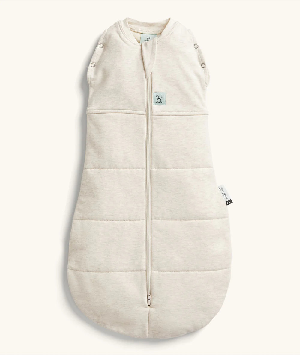 Beige baby sleeping bag with buttons on a white background