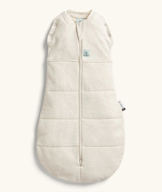 Beige baby sleeping bag with buttons on a white background