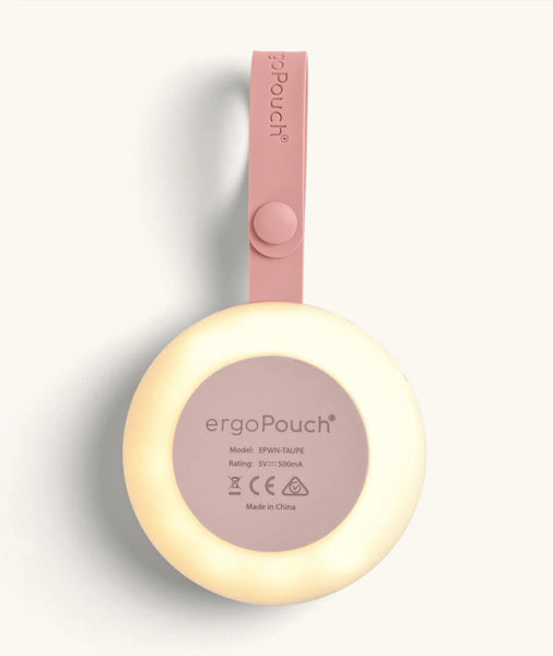 Pink ergonomic pouch with a light on a white background