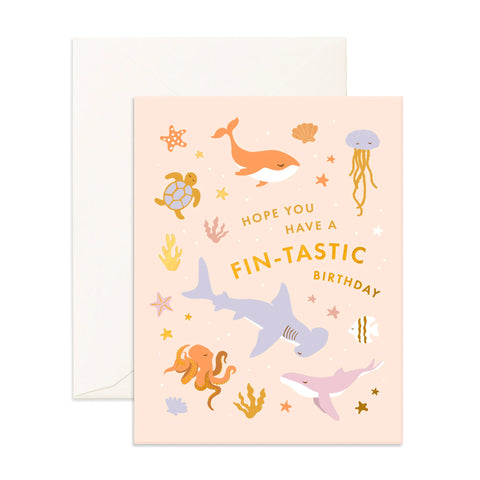 Birthday card with sea creature illustrations and text on a pink background