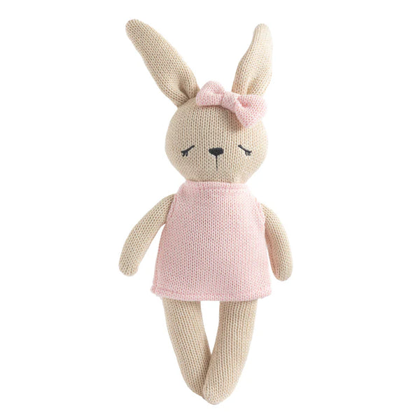 Knitted toy rabbit with a pink dress and bow on a white background