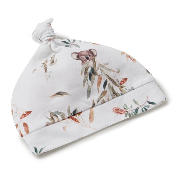 Baby hat with koala and leaf pattern on a white background