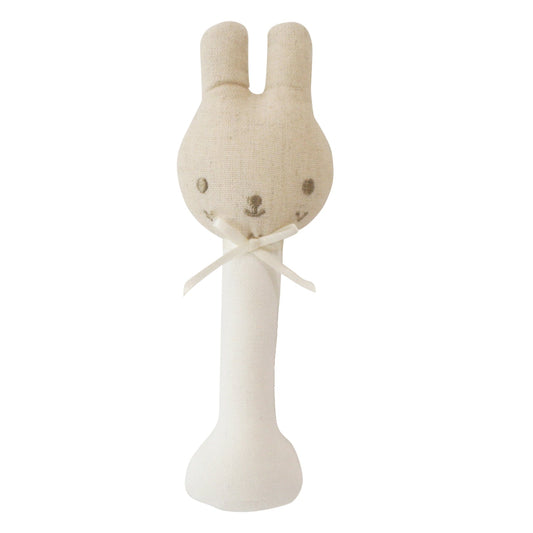 Stuffed rabbit toy with a white handle on a white background