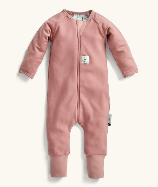 Pink baby onesie with a zipper on a white background