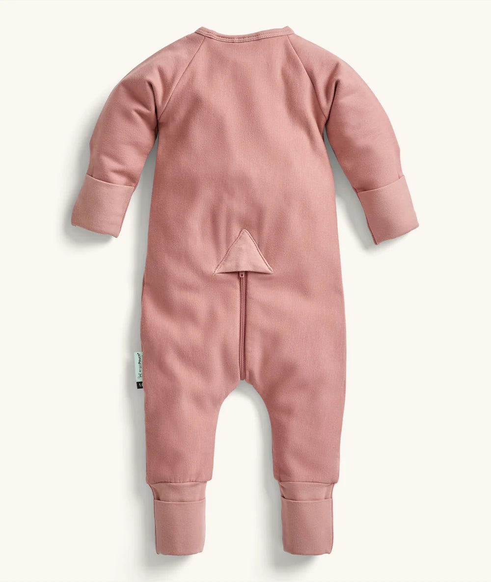 Pink baby onesie with a zipper on a white background
