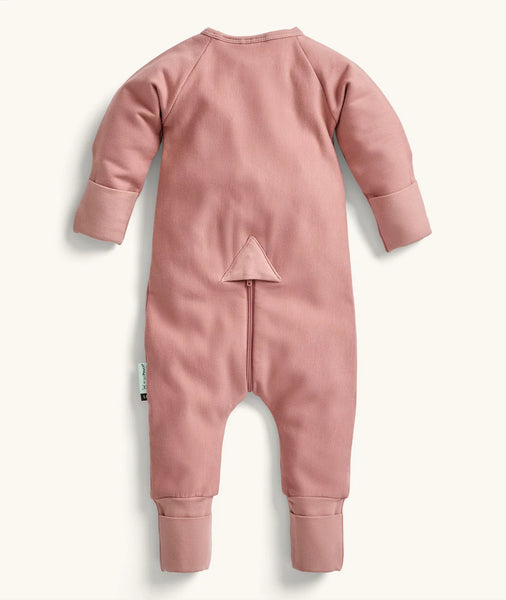 Pink baby onesie with a zipper on a white background