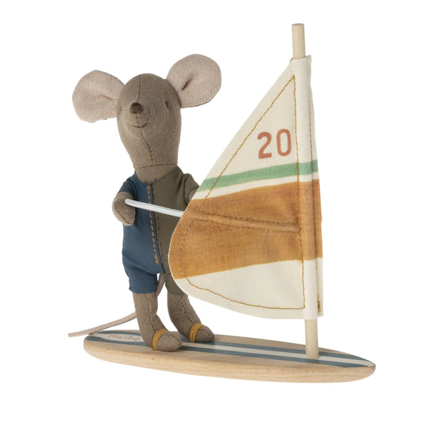 Stuffed mouse toy with a sailboat on a white background