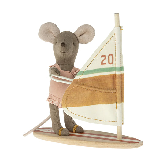 Stuffed mouse toy with a sailboat on a white background
