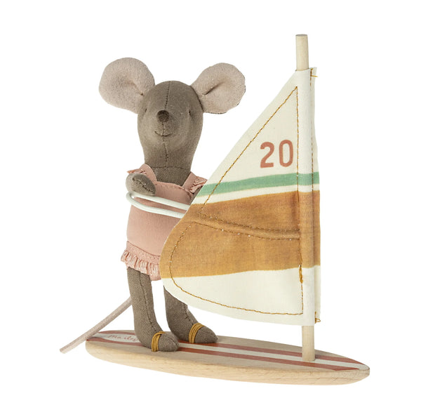 Stuffed mouse toy with a sailboat on a white background