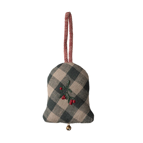 Checkered bell ornament with red berries on a white background