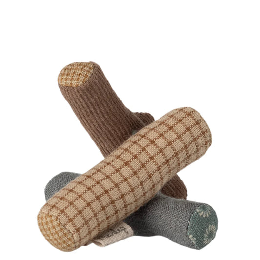 Knitted toy with brown, beige, and gray pattern on a white background