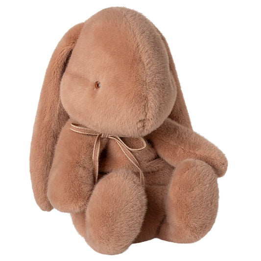 Brown plush bunny toy on a white background