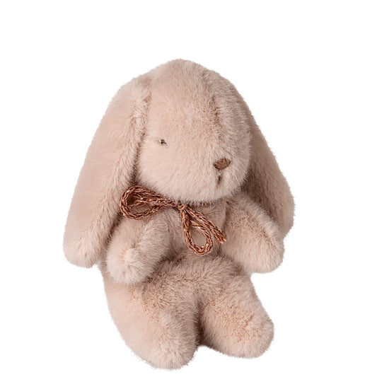 Plush bunny toy with a brown bow on a white background