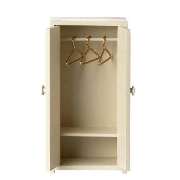Beige cabinet with gold hooks on a white background