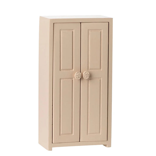 Beige two-door cabinet on a white background