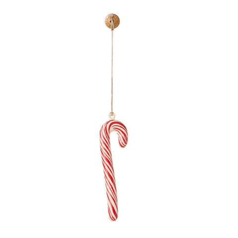 Red and white striped candy cane ornament on a white background