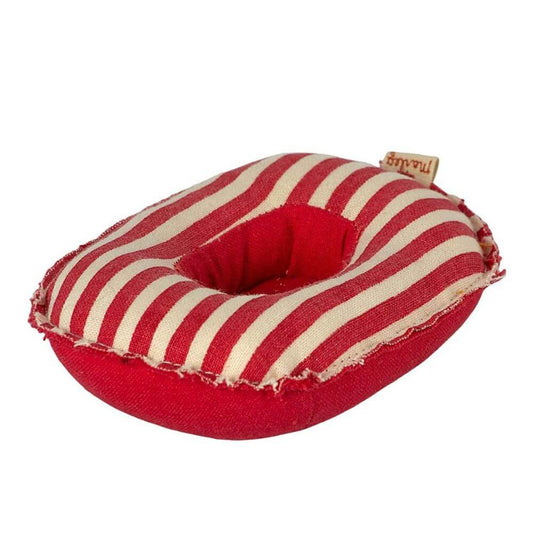 Red and white striped pet bed with a brand tag on a white background