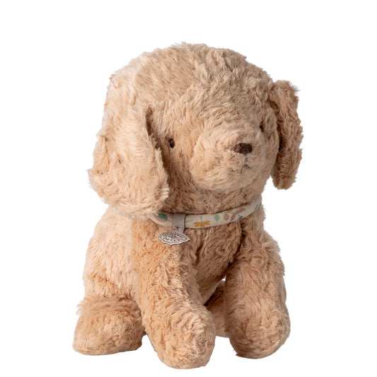 Plush dog toy with a collar on a white background