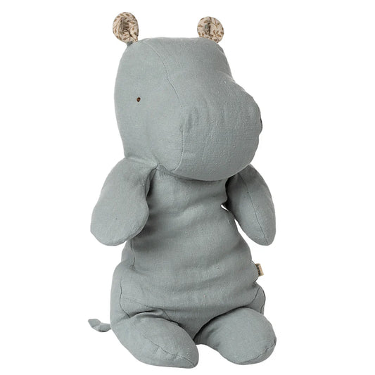 Plush toy hippo in light gray on a white background