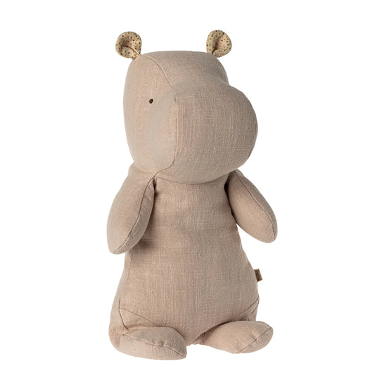 Beige stuffed animal toy with animal ears on a white background