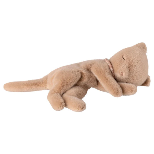 Plush toy cat lying down on a white background