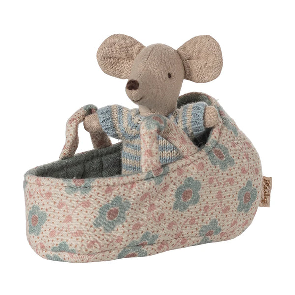 Stuffed mouse toy in a floral-patterned carriage on a white background