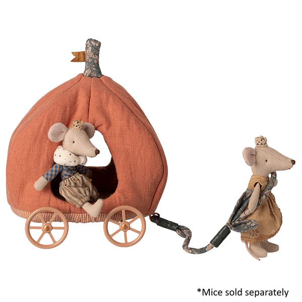 Decorative pumpkin with two mouse figures and a small log, on a white background.