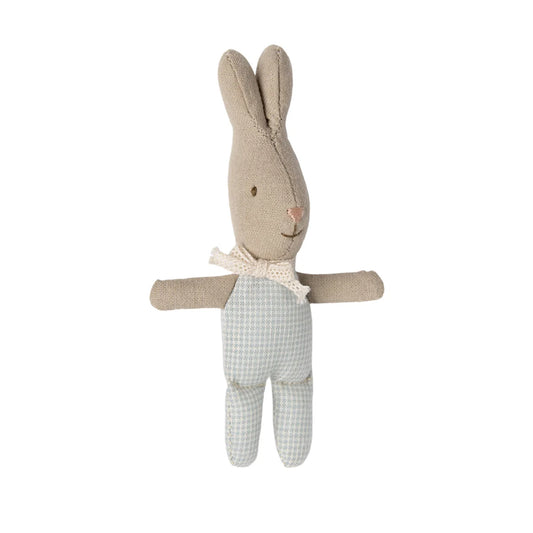 Stuffed rabbit toy with a bow tie and checkered pants on a white background