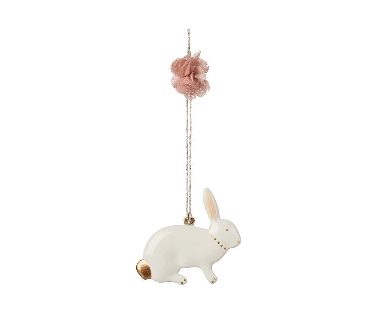 Decorative hanging rabbit ornament with pink flower on a white background